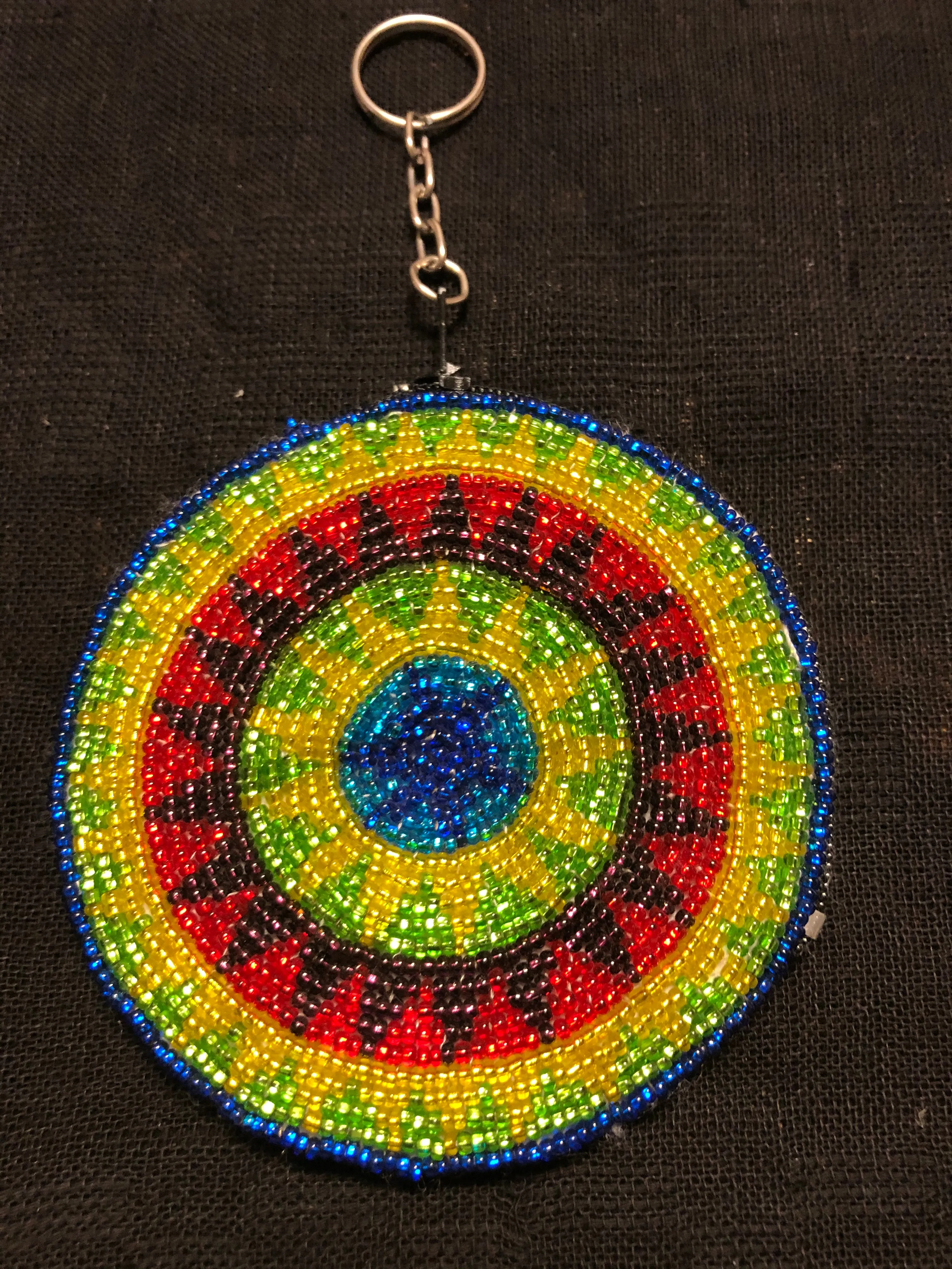 Guatemalan handcrafted glass bead round change purse with key ring. 3.5” diameter.